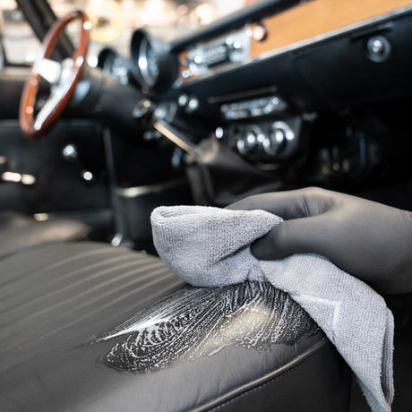 detiiling1.comLOURLOCK Classic Car Leather Care Set — wiping the lifted dirt off a classic car seat