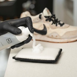 detiiling1.comLOURLOCK Sneaker Cleaner Set — cleaning foam on the pad, the dirty sneaker behind it